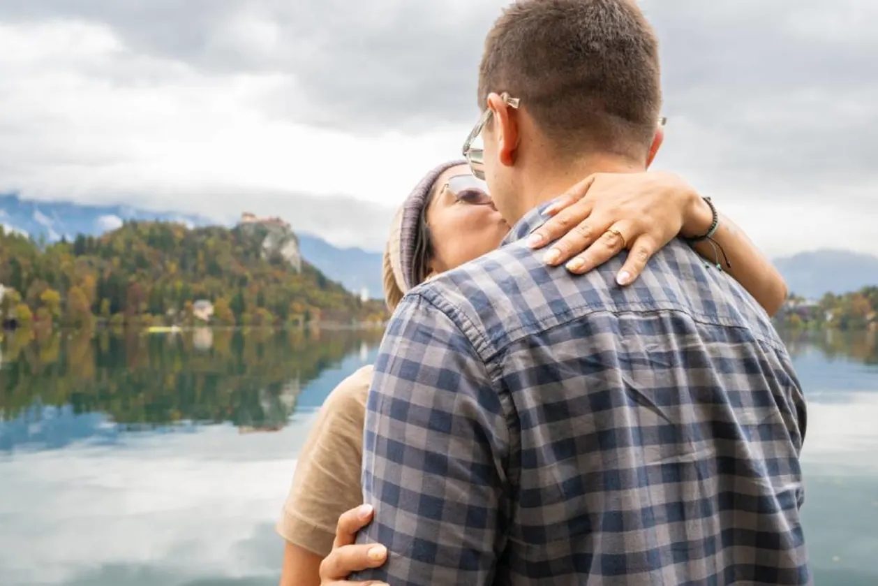 Couple embracing with Lake Bled in background